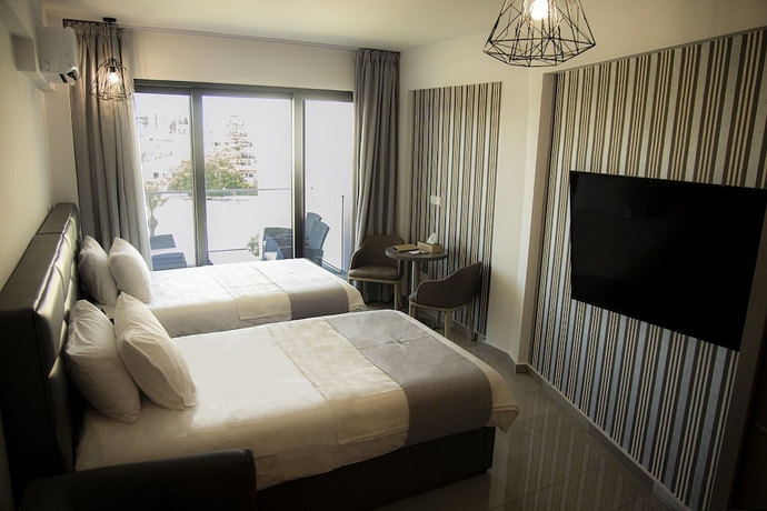 Imagen de la habitación del Hotel Jimmy\'s Suites. Foto 4