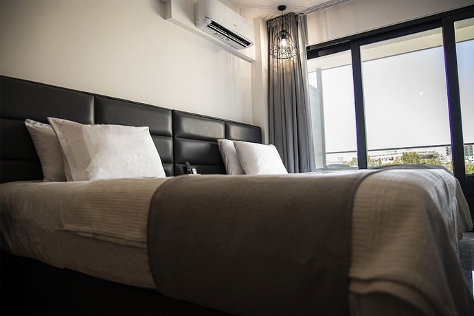 Imagen de la habitación del Hotel Jimmy\'s Suites. Foto 5
