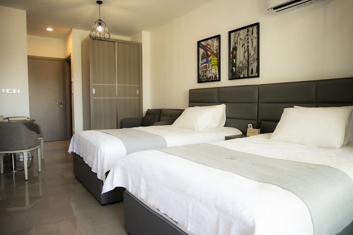 Imagen de la habitación del Hotel Jimmy\'s Suites. Foto 9