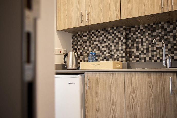 Imagen de la habitación del Hotel Jimmy\'s Suites. Foto 11