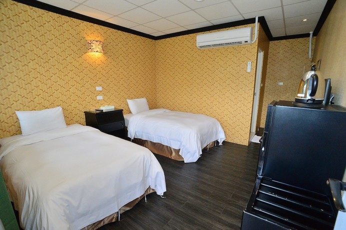 Imagen de la habitación del Hotel Jin Huei. Foto 11