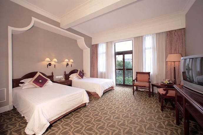 Imagen de la habitación del Hotel Jin Jiang Jing An. Foto 4
