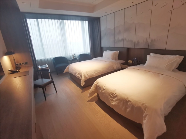 Imagen de la habitación del Hotel Jin Jiang Tian Cheng. Foto 2