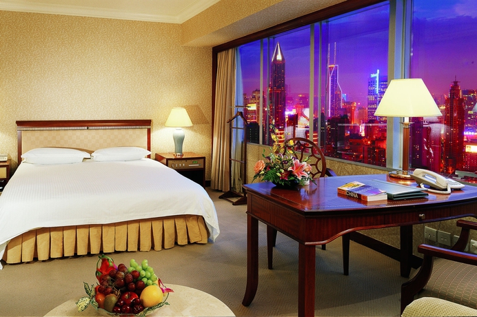 Imagen de la habitación del Hotel Jin Jiang Tower. Foto 7