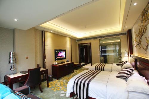 Imagen de la habitación del Hotel Jin Long Wan Hao. Foto 5