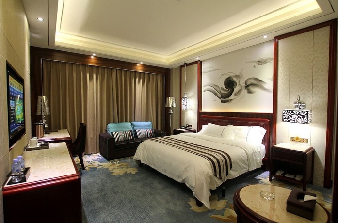 Imagen de la habitación del Hotel Jin Long Wan Hao. Foto 2