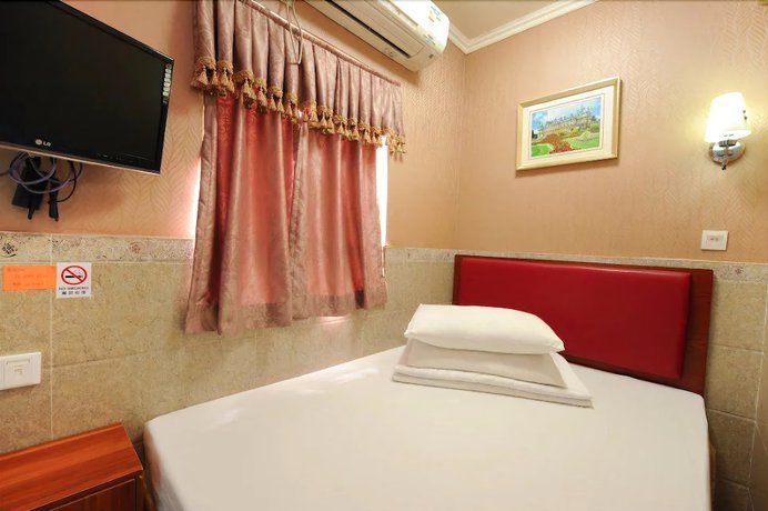 Imagen de la habitación del Hotel Jin Xiang. Foto 14