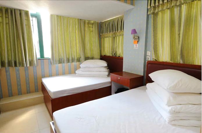 Imagen de la habitación del Hotel Jin Xiang. Foto 18