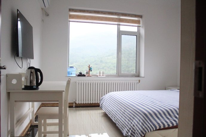 Imagen de la habitación del Hotel Jinan Banshan Linyun Resort Hotel. Foto 9