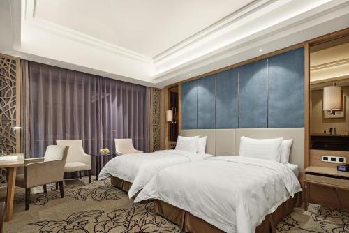 Imagen de la habitación del Hotel Jinan Luxury Blue Horizon. Foto 6