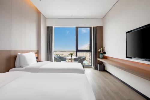 Imagen de la habitación del Hotel Jinan Zhonghai Kailu. Foto 13