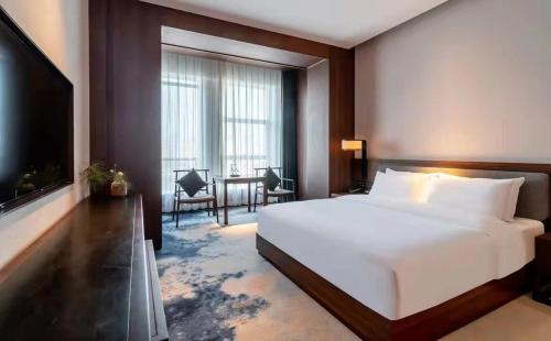 Imagen de la habitación del Hotel Jinan Ziyue Meixiu. Foto 14