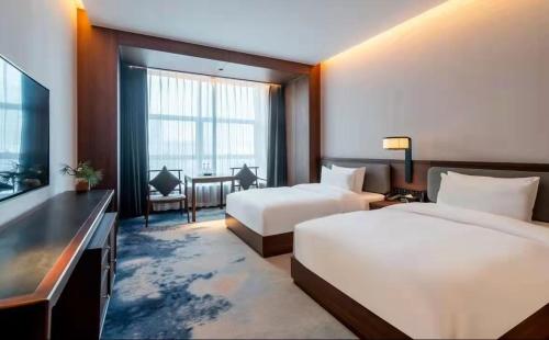 Imagen de la habitación del Hotel Jinan Ziyue Meixiu. Foto 16