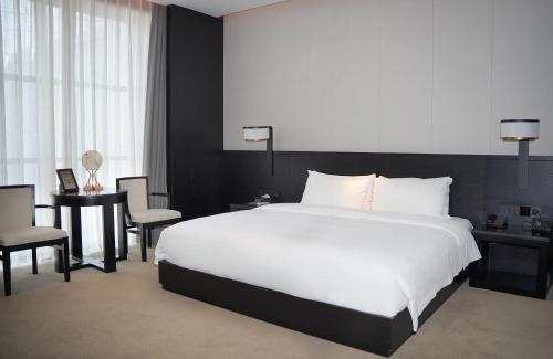Imagen de la habitación del Hotel Jinan Ziyue Meixiu. Foto 17