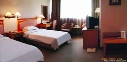 Imagen de la habitación del Hotel Jinbei Business Hotel. Foto 3