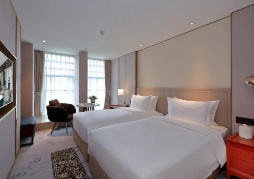 Imagen de la habitación del Hotel Jinfan Wanyuan. Foto 8