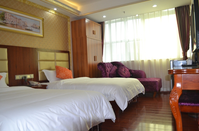 Imagen de la habitación del Hotel Jingdu. Foto 13