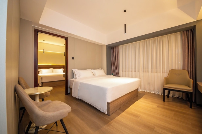 Imagen de la habitación del Hotel Jinguan Holiday. Foto 6