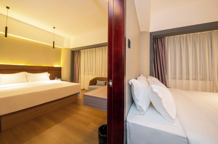 Imagen de la habitación del Hotel Jinguan Holiday. Foto 7