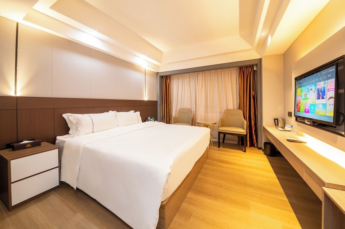 Imagen de la habitación del Hotel Jinguan Holiday. Foto 8
