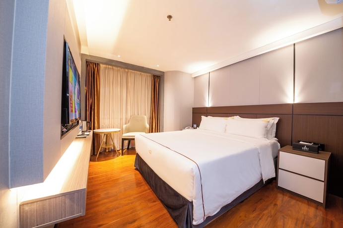 Imagen de la habitación del Hotel Jinguan Holiday. Foto 9