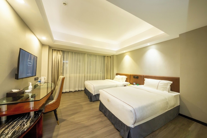 Imagen de la habitación del Hotel Jinguan Holiday. Foto 11
