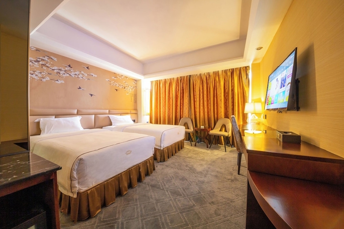 Imagen de la habitación del Hotel Jinguan Holiday. Foto 13
