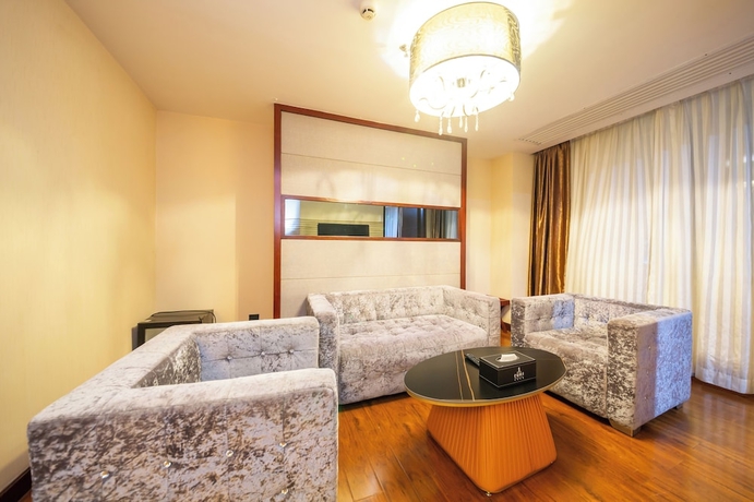 Imagen de la habitación del Hotel Jinguan Holiday. Foto 15