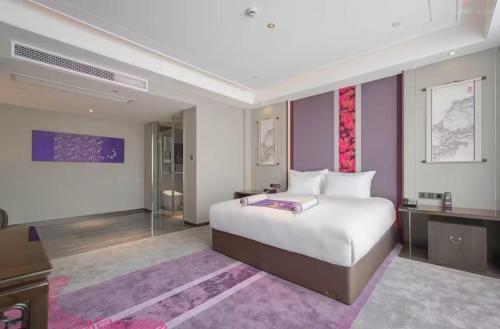 Imagen de la habitación del Hotel Jinhua Four Seasons Ruili. Foto 13