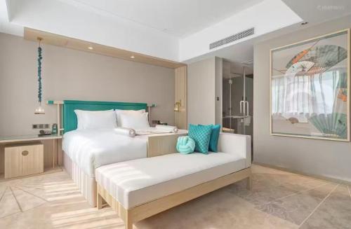 Imagen de la habitación del Hotel Jinhua Four Seasons Ruili. Foto 14