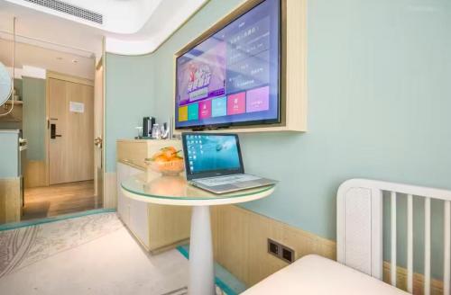 Imagen de la habitación del Hotel Jinhua Four Seasons Ruili. Foto 15