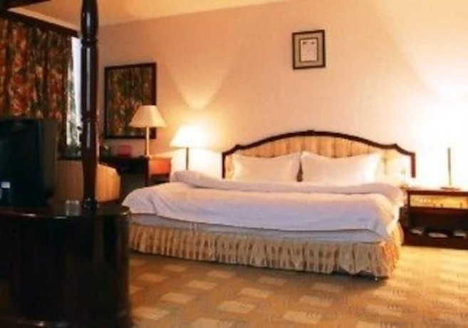 Imagen de la habitación del Hotel Jinhua International Hotel - Kunming. Foto 4