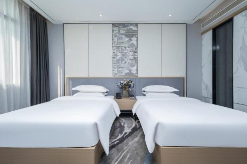 Imagen de la habitación del Hotel Jinhui Royal Navigation International. Foto 20