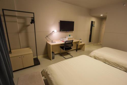Imagen de la habitación del Hotel Jinjiang Inn Liuzhou Railway Station North. Foto 4