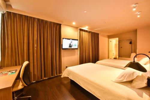 Imagen de la habitación del Hotel Jinjiang Inn Select Haikou Qilou Old Street Binhai Avenue. Foto 7