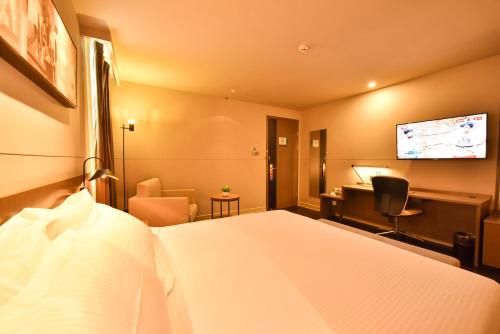 Imagen de la habitación del Hotel Jinjiang Inn Select Haikou Qilou Old Street Binhai Avenue. Foto 10