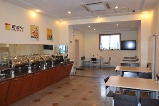 Imagen del bar/restaurante del Hotel Jinjiang Inn Yantai International Exhibition Center. Foto 6