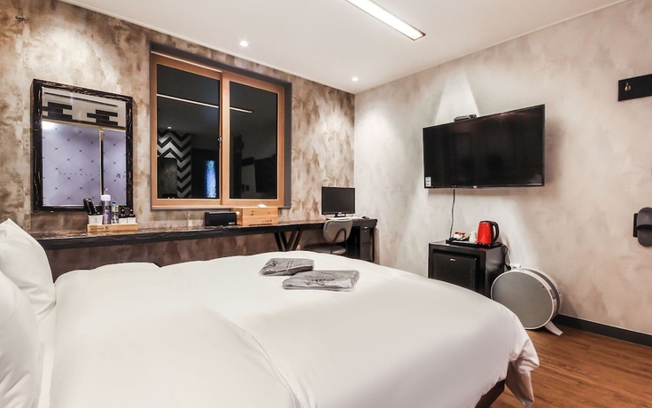 Imagen de la habitación del Hotel Jinju JS. Foto 14