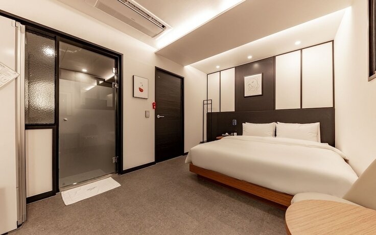 Imagen de la habitación del Hotel Jinju Vovo. Foto 18