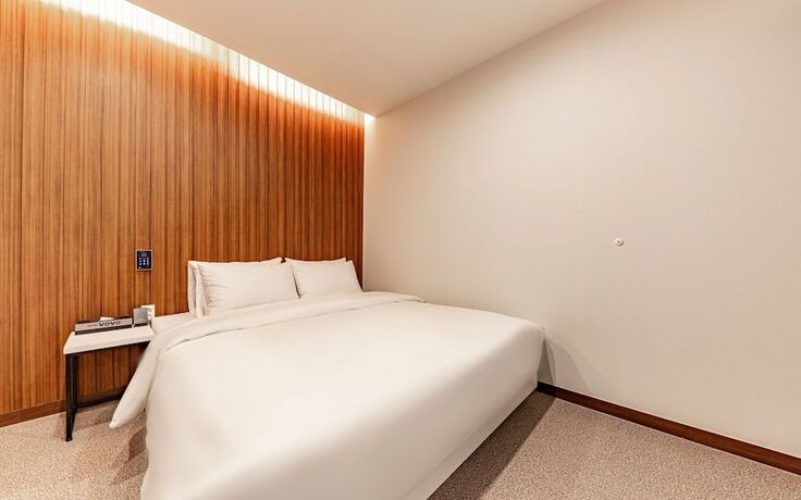 Imagen de la habitación del Hotel Jinju Vovo. Foto 19