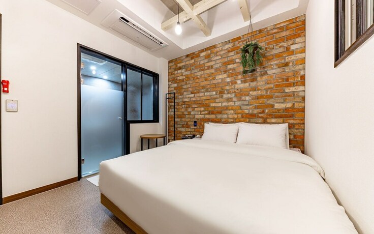 Imagen de la habitación del Hotel Jinju Vovo. Foto 20