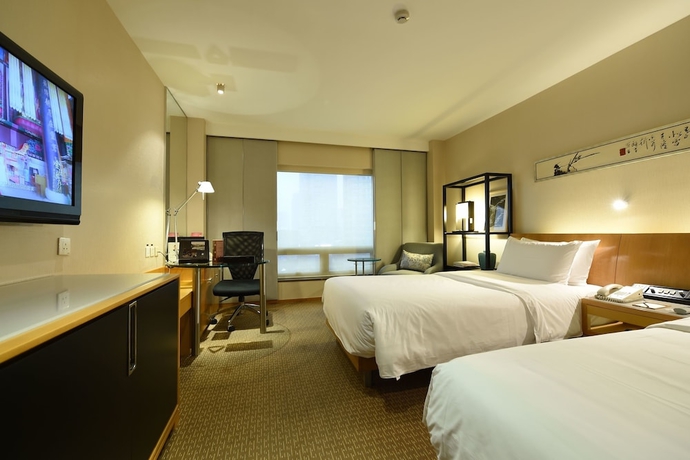 Imagen de la habitación del Hotel Jinling Nanjing. Foto 5