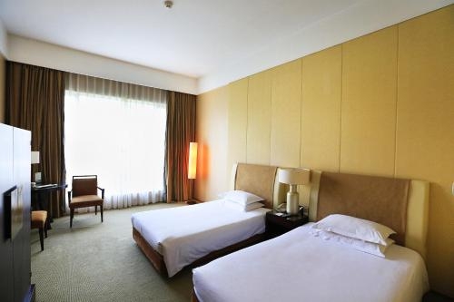 Imagen de la habitación del Hotel Jinling Resort Nanjing. Foto 3