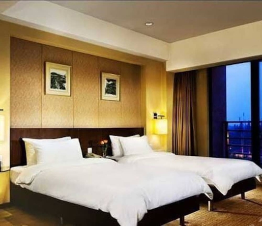 Imagen de la habitación del Hotel Jinling Riverside Nanjing. Foto 12