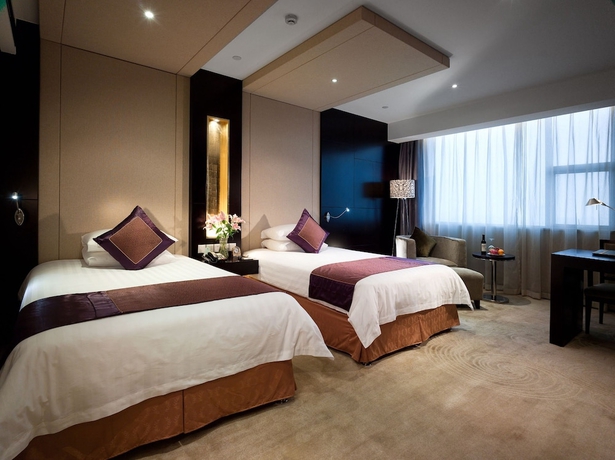 Imagen de la habitación del Hotel Jinling Yangzhou. Foto 13