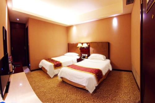 Imagen de la habitación del Hotel Jinziyin Business. Foto 7