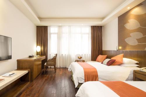 Imagen de la habitación del Hotel Jiuhua Mountain Julong. Foto 8