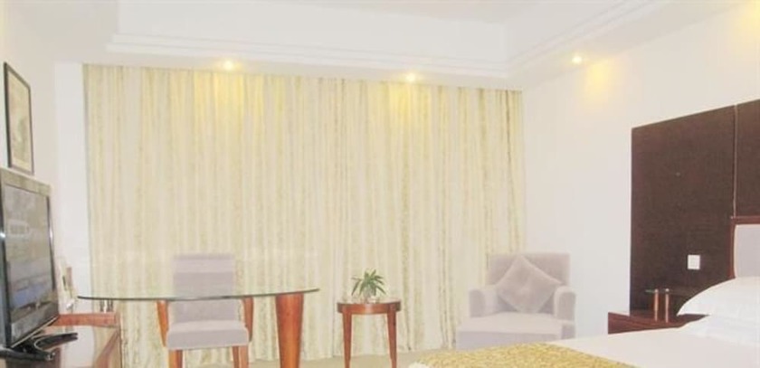 Imagen de la habitación del Hotel Jiuhuashan Center. Foto 9