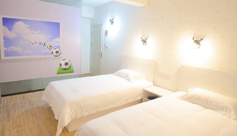 Imagen de la habitación del Hotel Jiulongwan Boutique Apartment. Foto 8