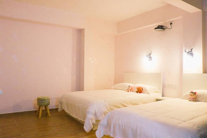 Imagen de la habitación del Hotel Jiulongwan Boutique Apartment. Foto 9